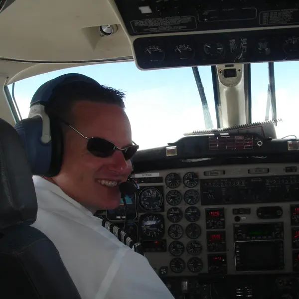 Captain smiling in the cockpit